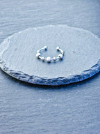 Anti-Stress-Ring Stardust – silberner Spinner Ring mit drehbaren Kugeln