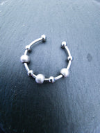 Anti-Stress-Ring Stardust – silberner Spinner Ring mit drehbaren Kugeln